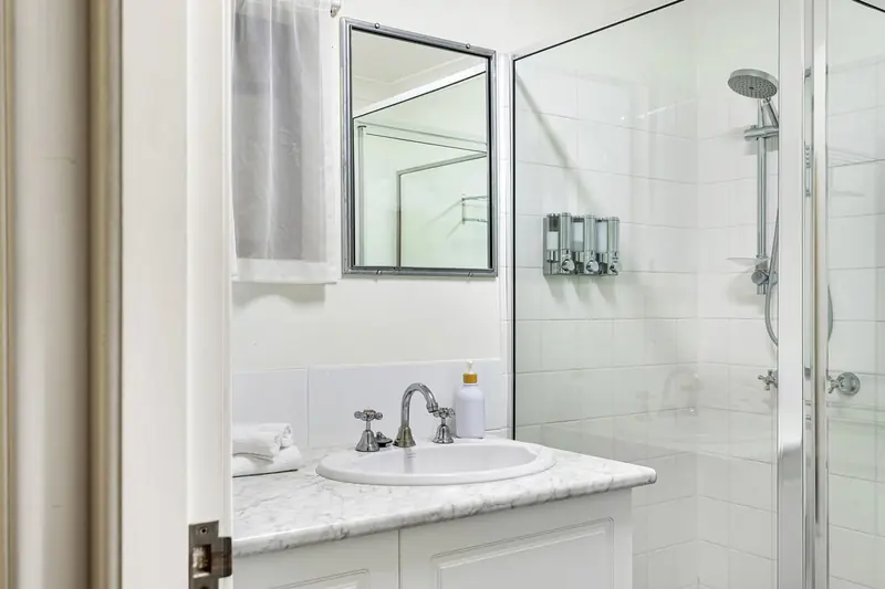 Vanity and mirror in the suite bathroom