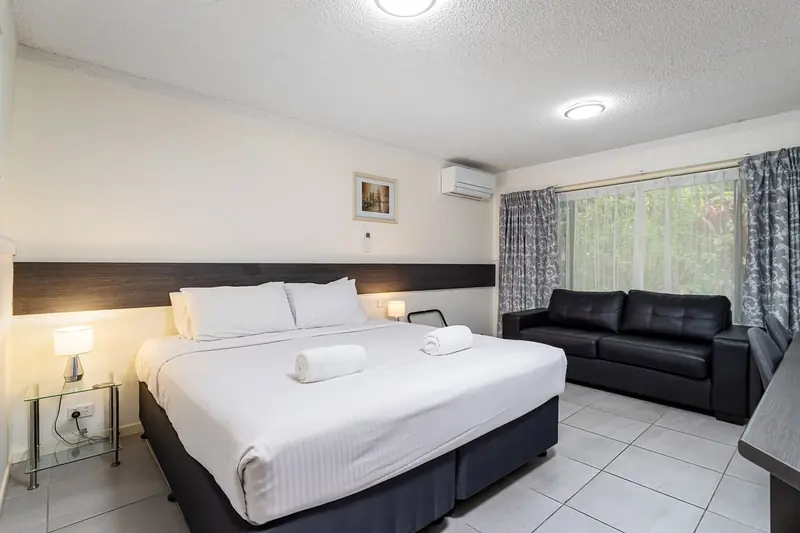 King suite at Gallery Motel with a king bed and a lounge area