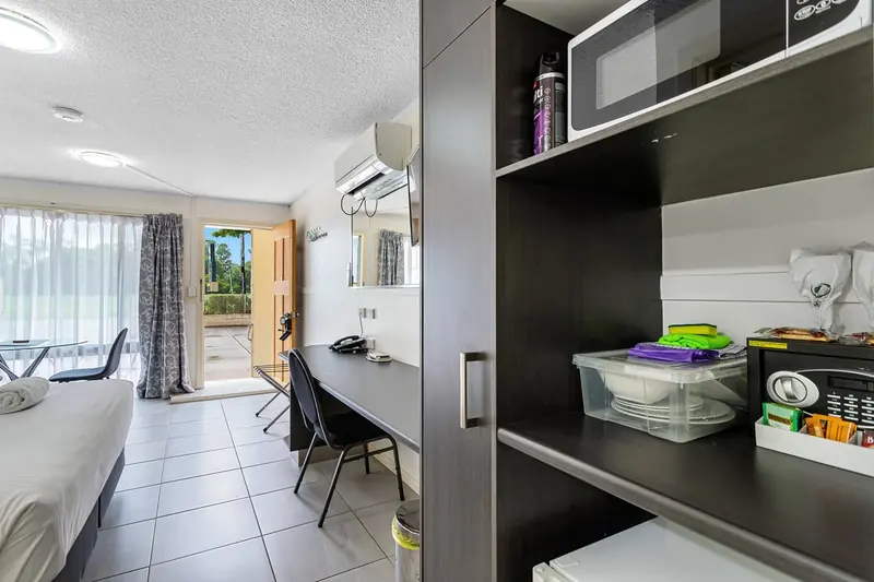 Kitchenette with a microwave and fridge