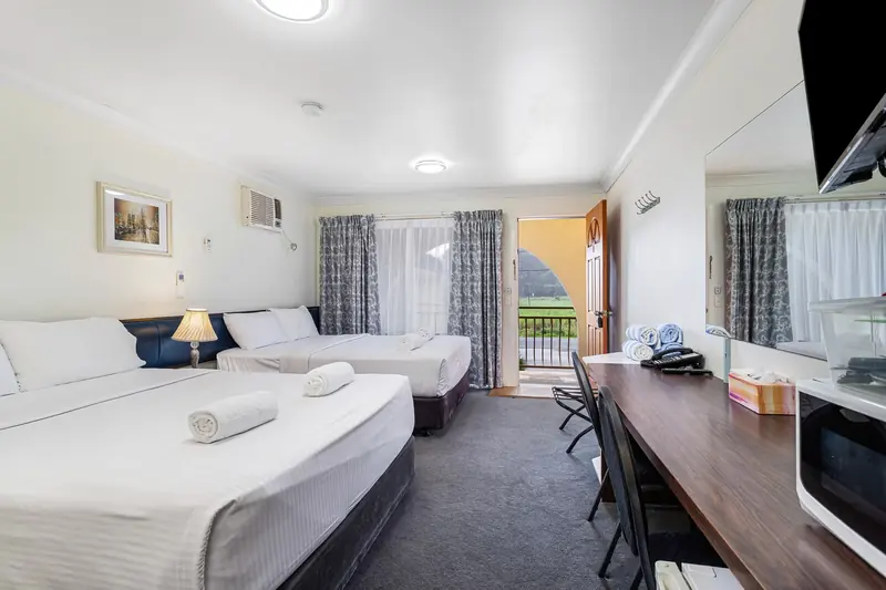 Twin room at Gallery Motel with two queen beds and doors onto the balcony